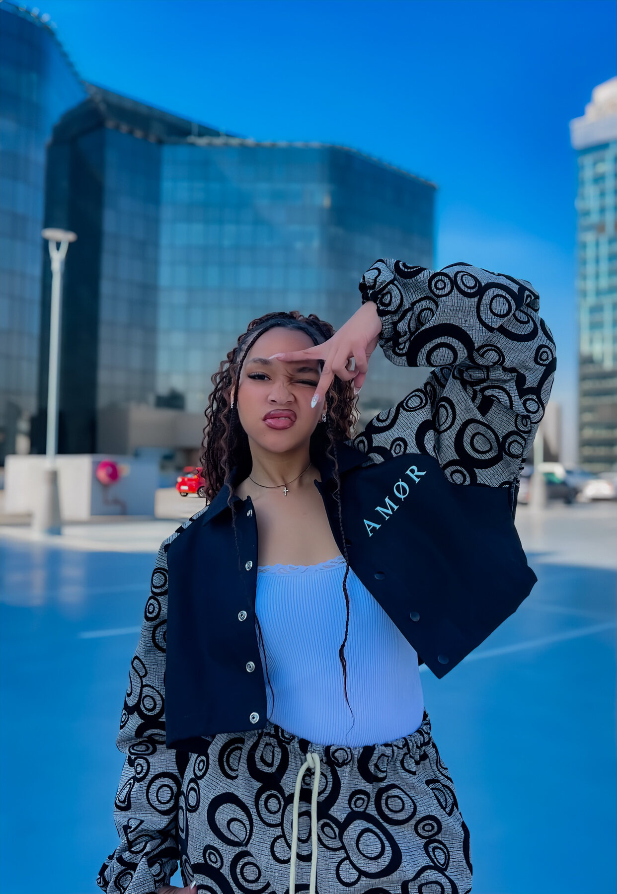 AMOR model in a patterned outfit